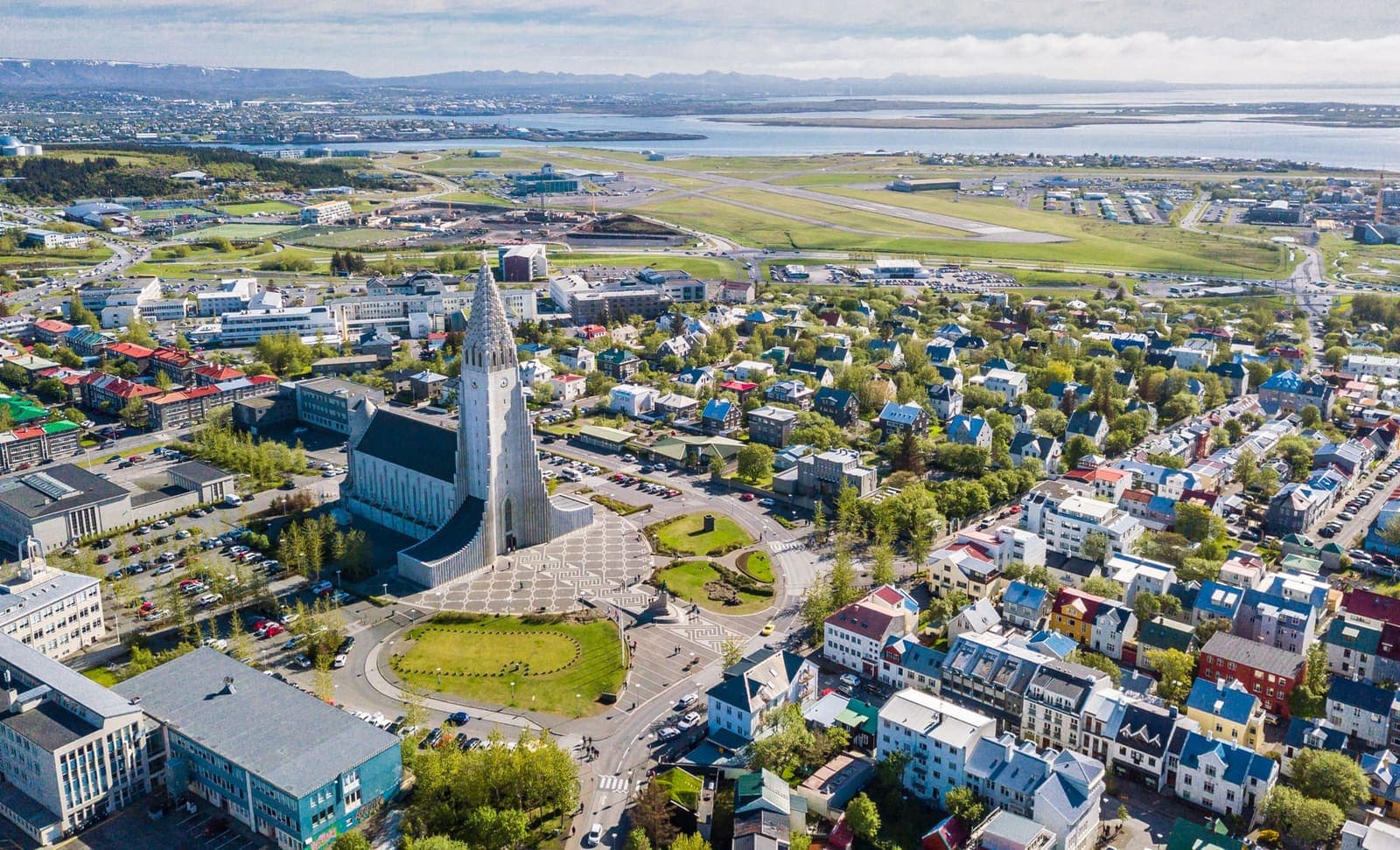 Aerial view over central Reykjavík, the airport, and Faxaflói bay